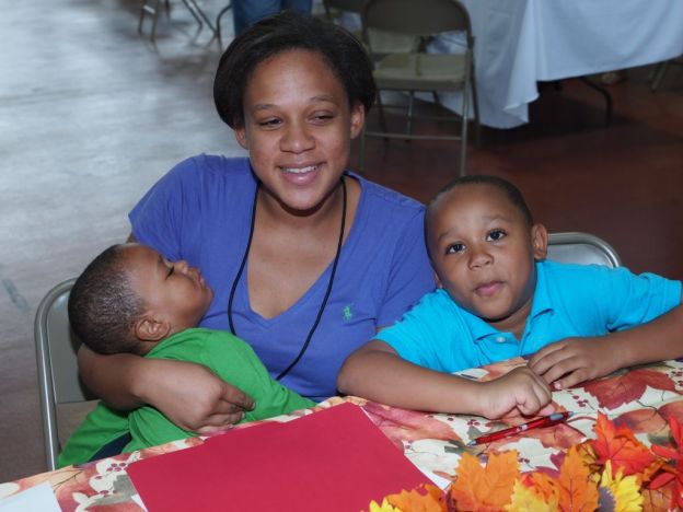 Featured in this photo are a homeless mother and her two children who attended CACH’s Project Homeless Connect in 2012.